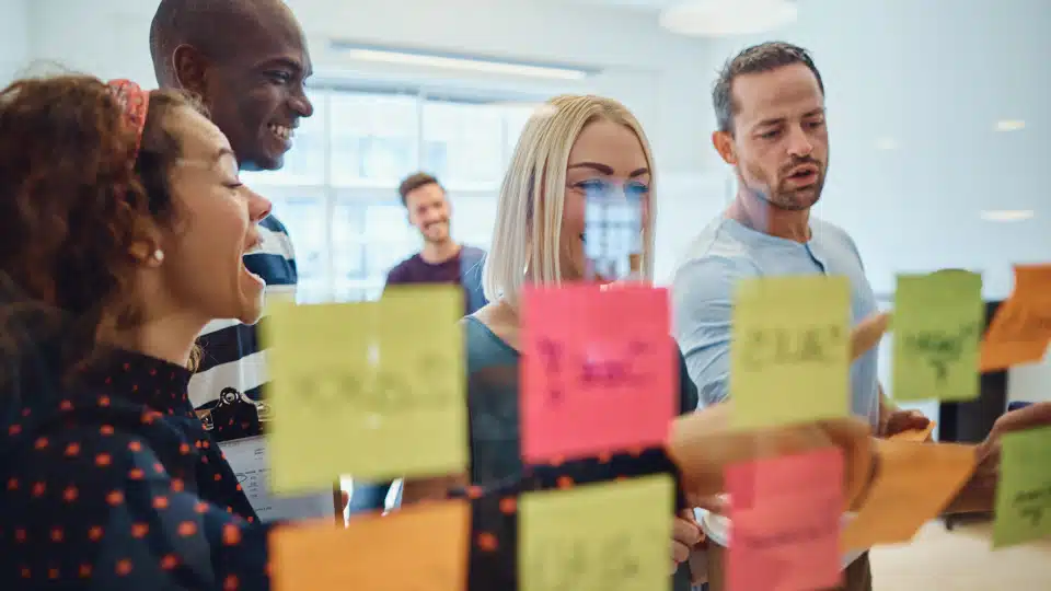 Work with a software development agency or hire your own in-house team?
